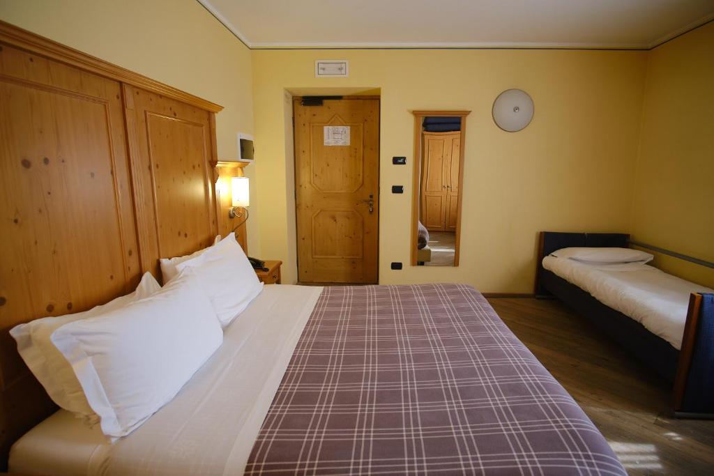 Postel nebo postele na pokoji v ubytování Hotel Bes & Spa
