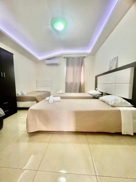 A bed or beds in a room at Anatoli deluxe house