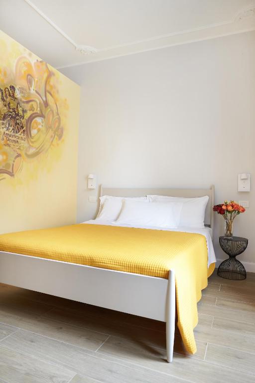 Postel nebo postele na pokoji v ubytování Reyes Suite & Rooms