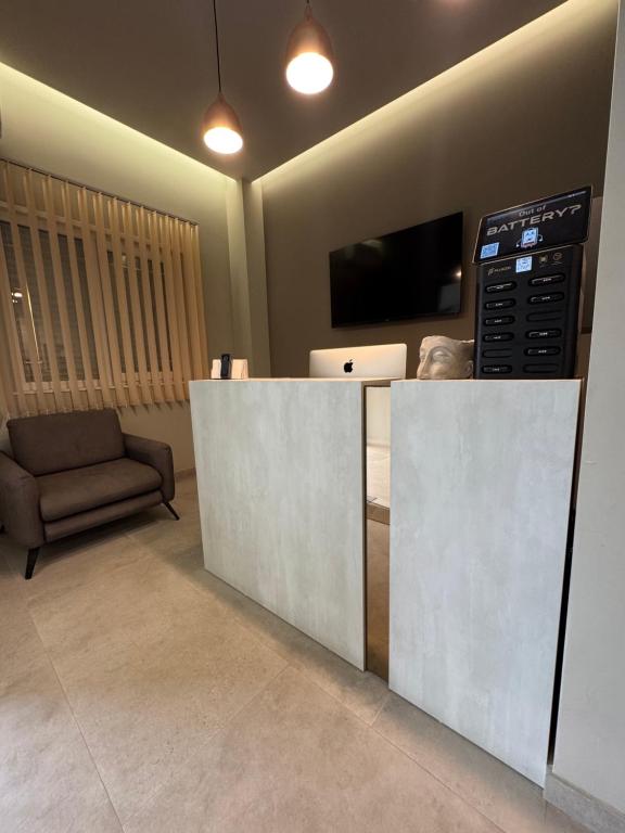 TV a/nebo společenská místnost v ubytování Nuna Hotel & Apartments