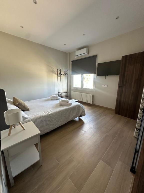 Posteľ alebo postele v izbe v ubytovaní La Casa del Tejado Verde Toledo