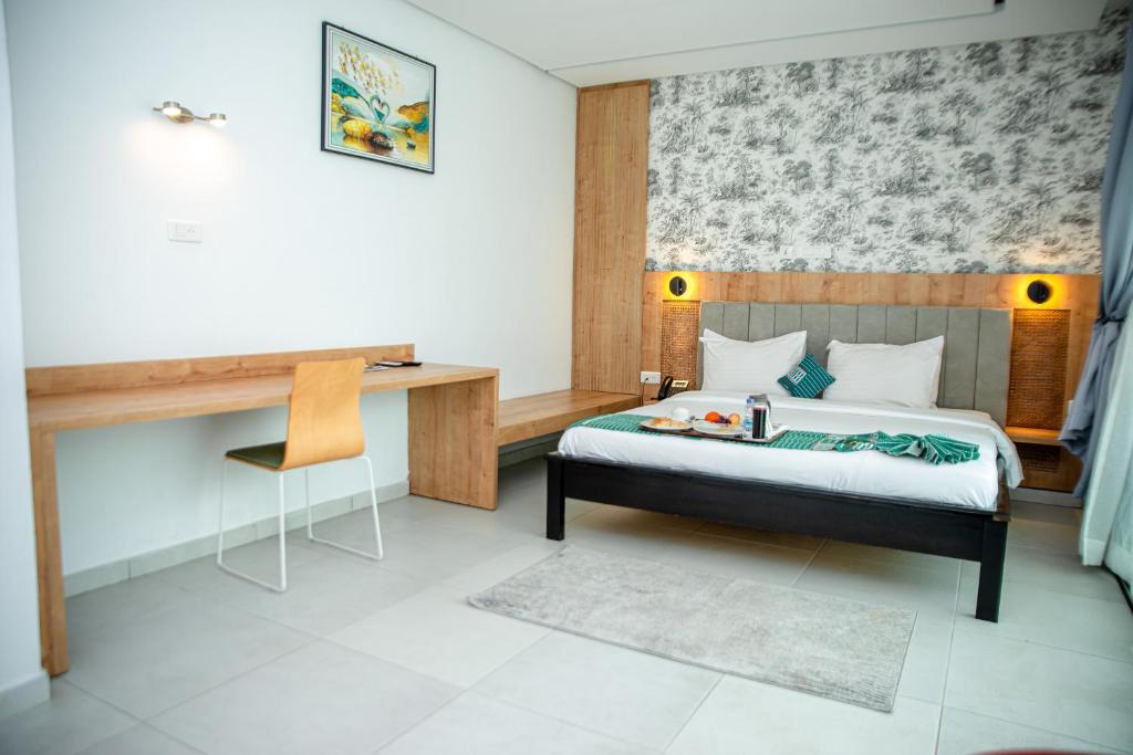 Postel nebo postele na pokoji v ubytování Hotel Yatchenin Abidjan