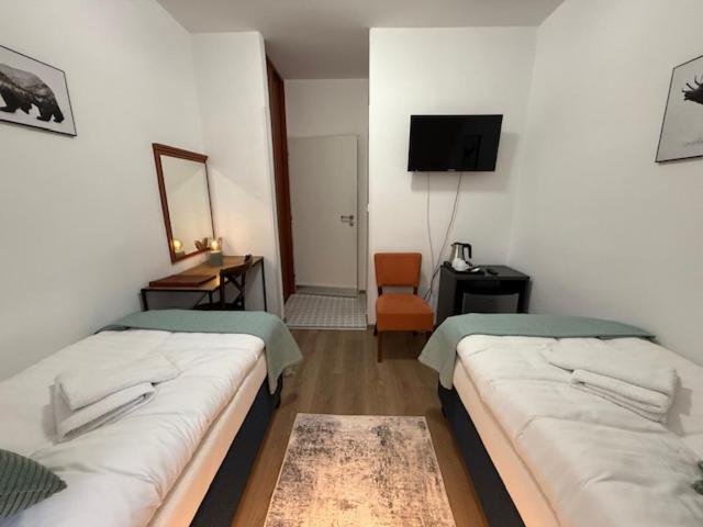 A bed or beds in a room at Penzión U Srnčíka