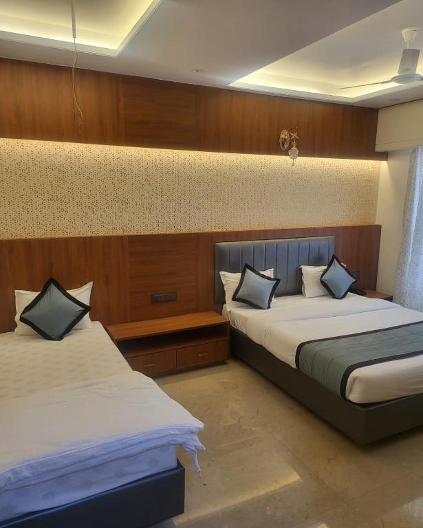 Postel nebo postele na pokoji v ubytování Hotel Sai D-lax
