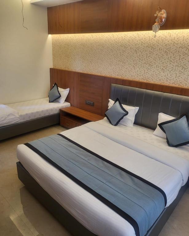 Postel nebo postele na pokoji v ubytování Hotel Sai D-lax