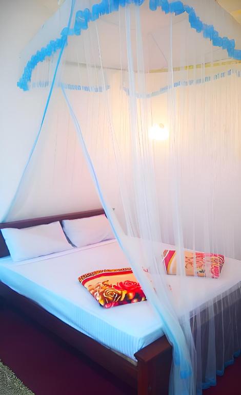 Postel nebo postele na pokoji v ubytování Senehas Homestay