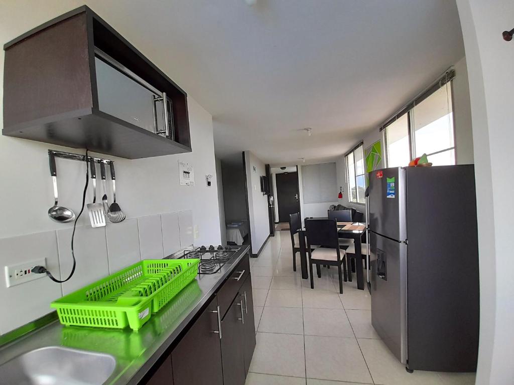 Kuchyň nebo kuchyňský kout v ubytování Aparthotel 2km Parque del Café BOOKUTRIP - 311-227-59-73