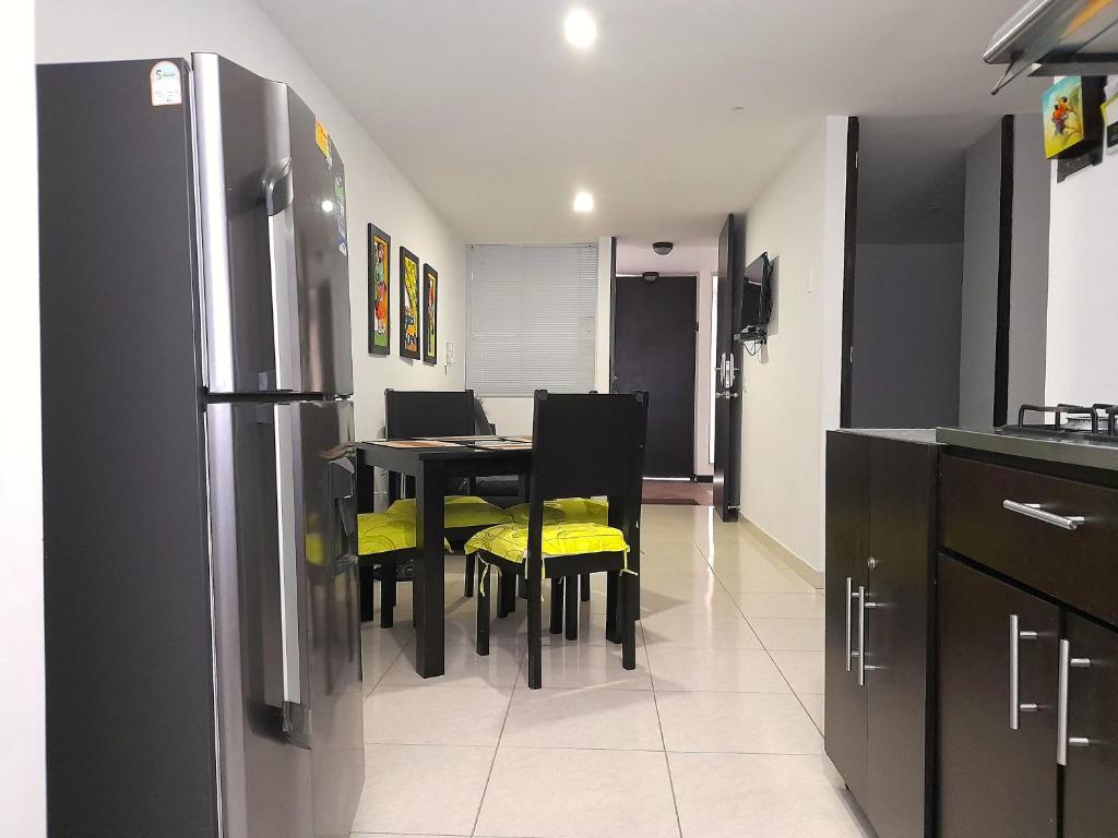 Kuchyň nebo kuchyňský kout v ubytování Aparthotel 2km Parque del Café BOOKUTRIP - 311-227-59-73