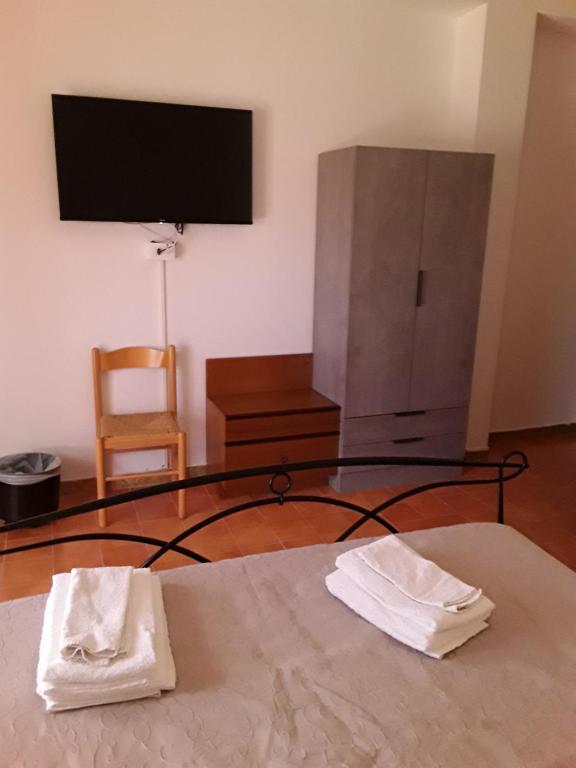 TV a/nebo společenská místnost v ubytování L'Aragosta Guesthouse