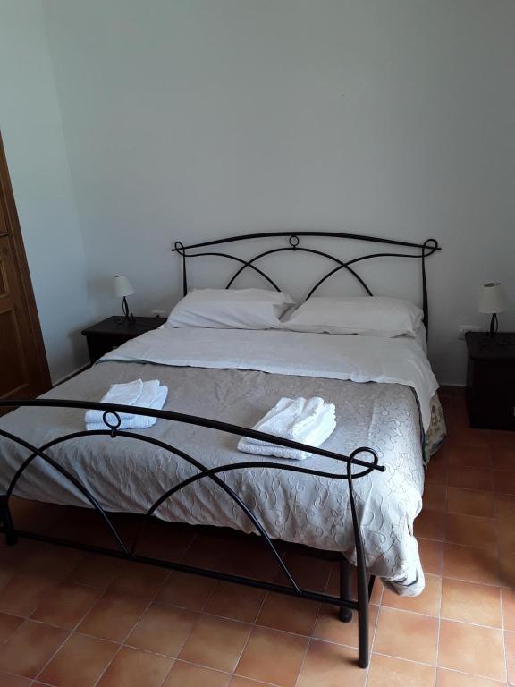 Postel nebo postele na pokoji v ubytování L'Aragosta Guesthouse
