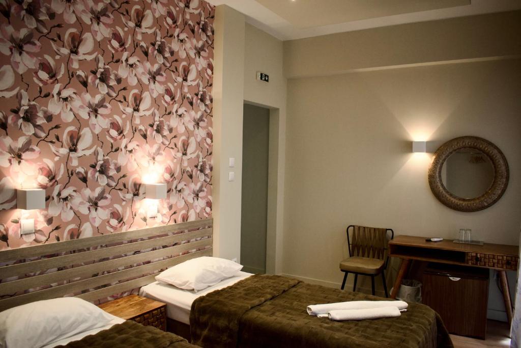 Postel nebo postele na pokoji v ubytování Nafsika Hotel Athens Centre