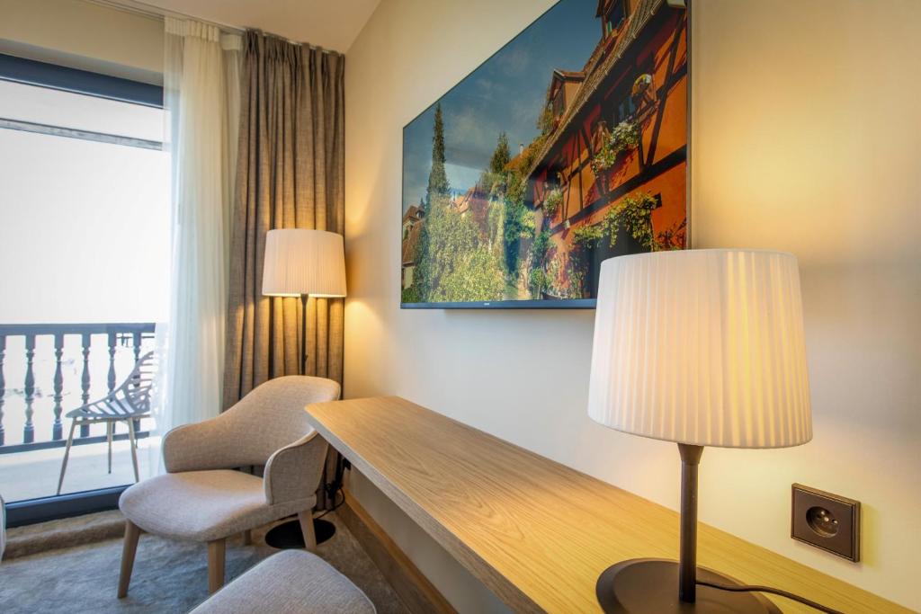 Posezení v ubytování Hôtel Terra Vinum