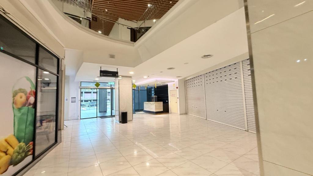an empty hallway in a building with a ceiling at Colony Service Suites Kuala Lumpur in Kuala Lumpur