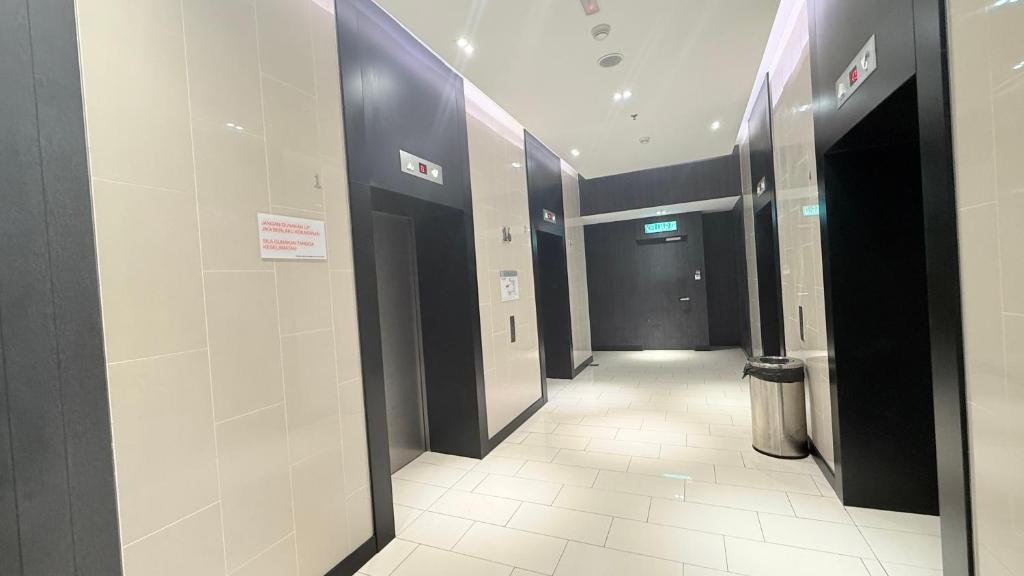 a hallway with elevators in a building at Colony Service Suites Kuala Lumpur in Kuala Lumpur