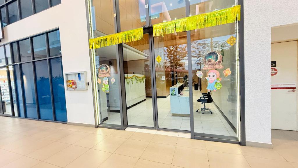 a store window with a yellow ribbon in a mall at Colony Service Suites Kuala Lumpur in Kuala Lumpur