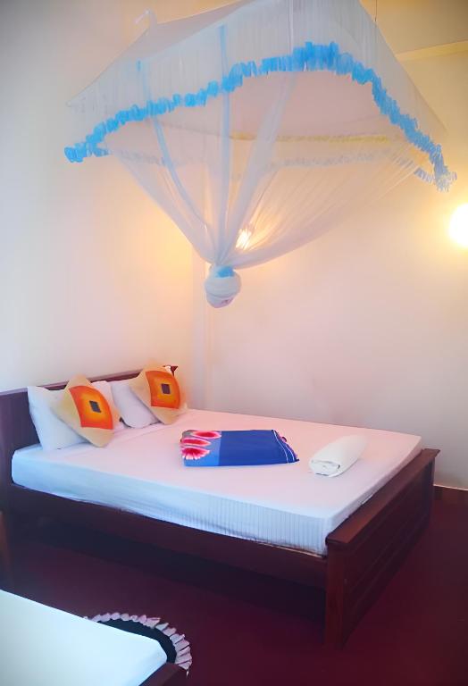 Postel nebo postele na pokoji v ubytování Senehas Homestay