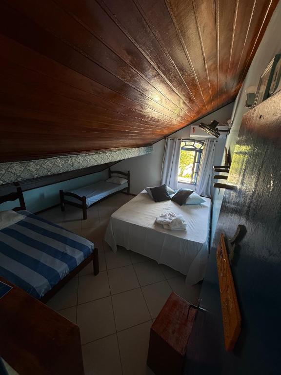 Postel nebo postele na pokoji v ubytování Casa dos Franceses Ilha Grande