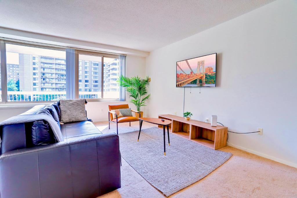 a living room with a couch and a table at Prime Location! Spacious & Comfy in Arlington