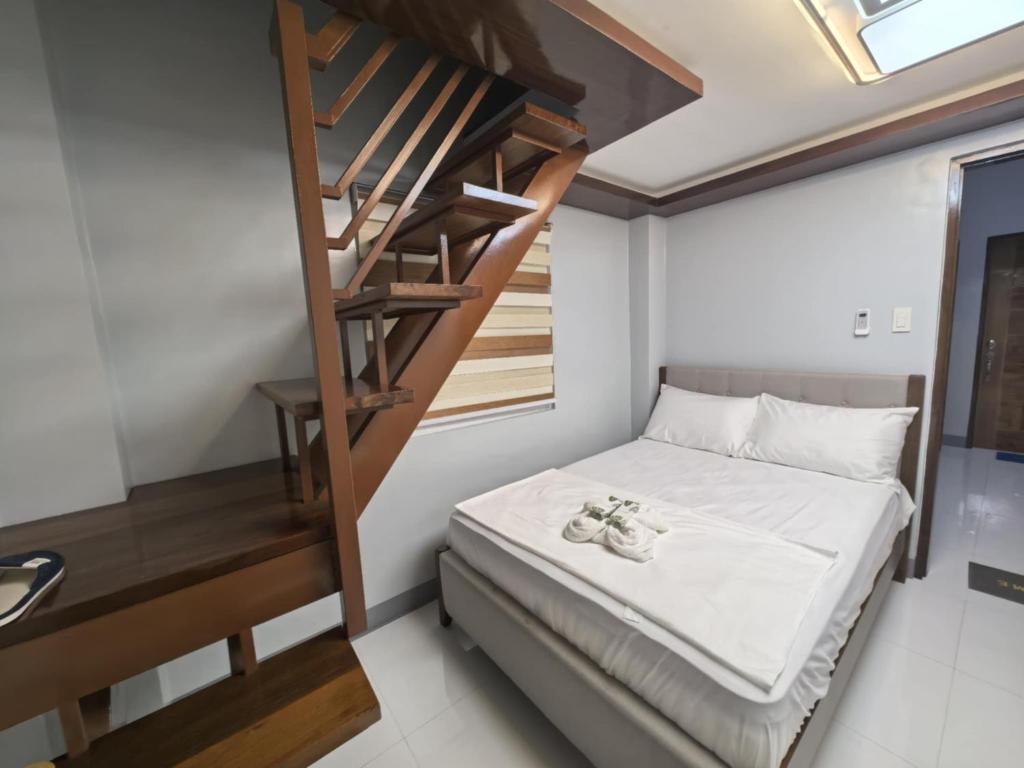 Postel nebo postele na pokoji v ubytování Yurich Hotel
