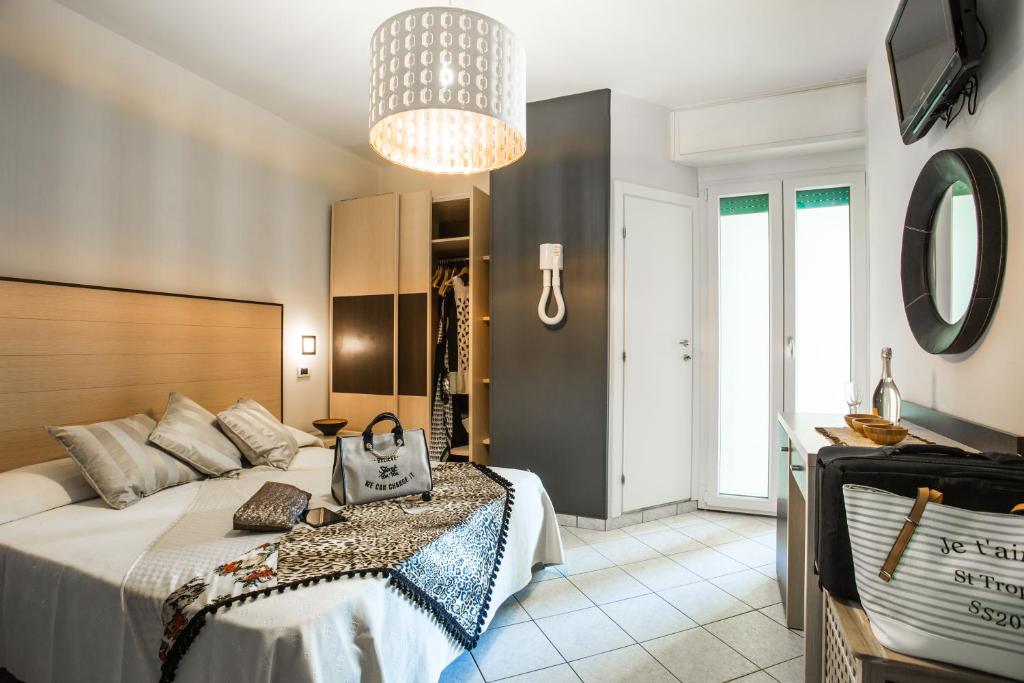 Postel nebo postele na pokoji v ubytování Hotel Thea