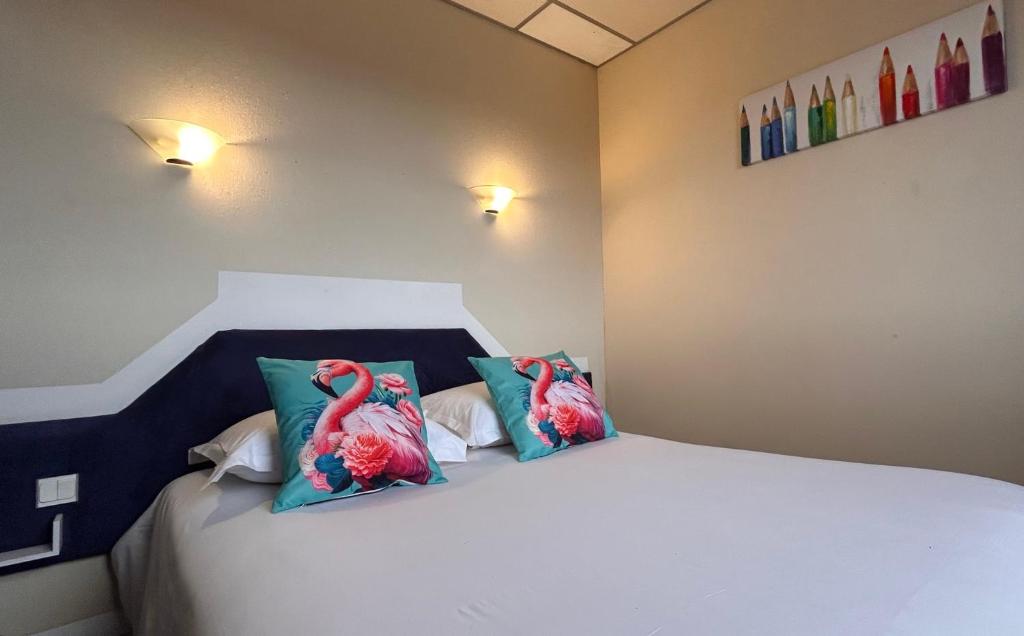 Postel nebo postele na pokoji v ubytování Fasthotel L'Eldorado