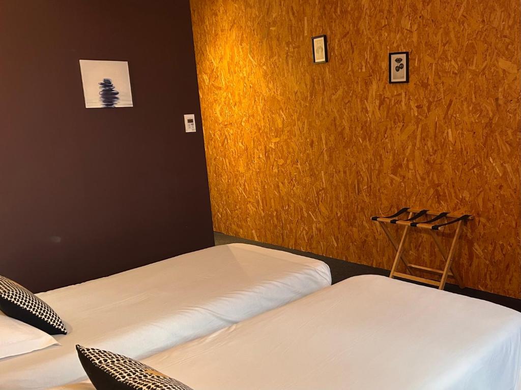 Postel nebo postele na pokoji v ubytování Fasthotel L'Eldorado