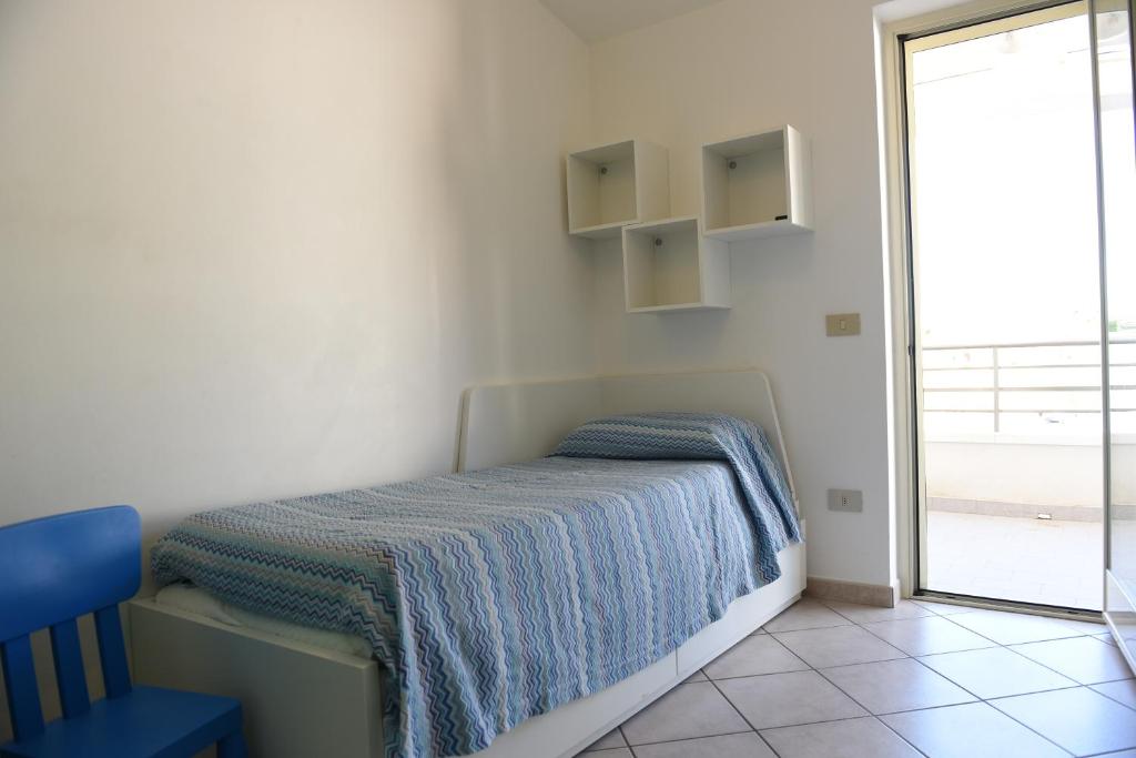 Posteľ alebo postele v izbe v ubytovaní Casa vacanze La Balena2