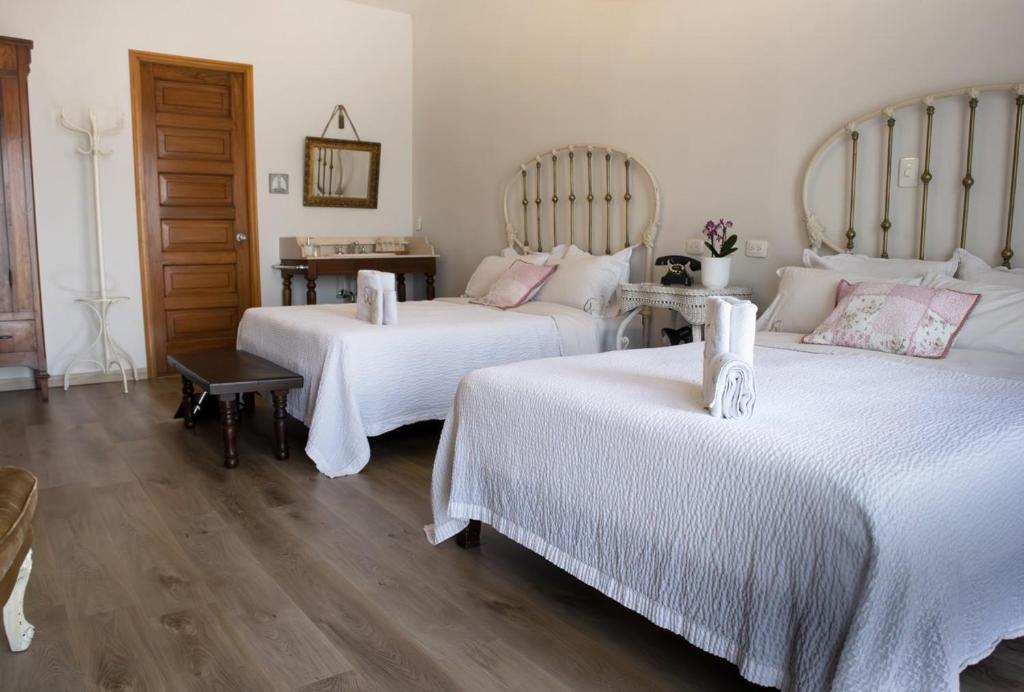Postel nebo postele na pokoji v ubytování Hotel Don Alfonso