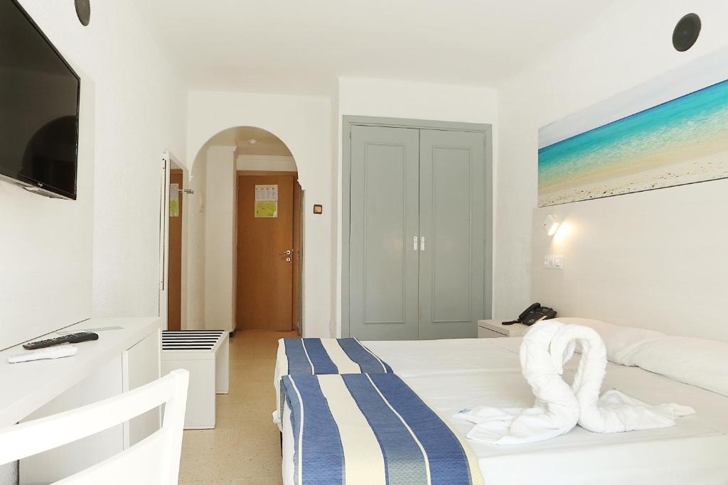 Postel nebo postele na pokoji v ubytování Hotel Cassandra