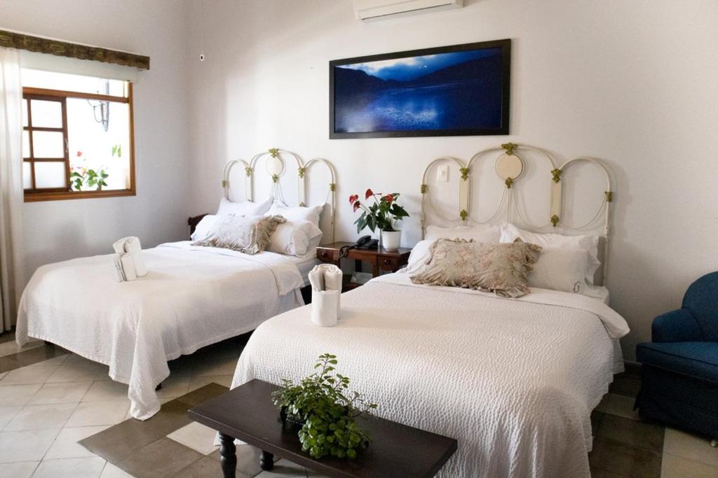 Postel nebo postele na pokoji v ubytování Hotel Don Alfonso