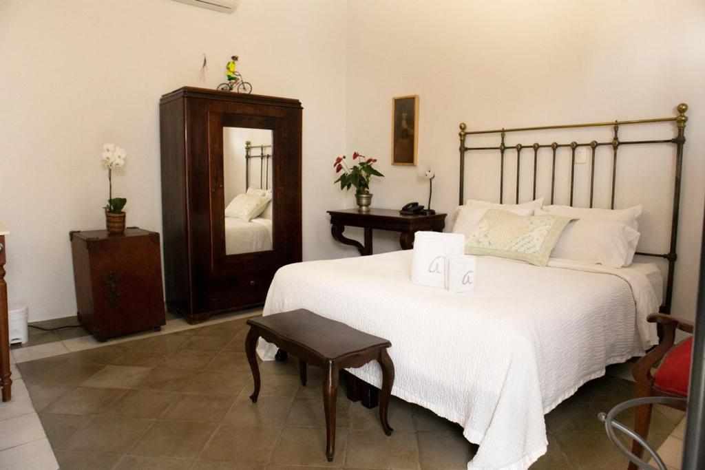 Postel nebo postele na pokoji v ubytování Hotel Don Alfonso