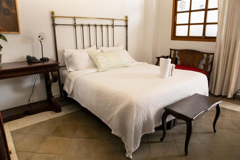 Postel nebo postele na pokoji v ubytování Hotel Don Alfonso