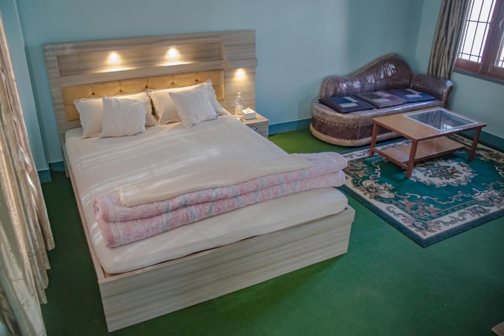 Ένα ή περισσότερα κρεβάτια σε δωμάτιο στο organic healing home
