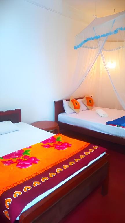 Postel nebo postele na pokoji v ubytování Senehas Homestay