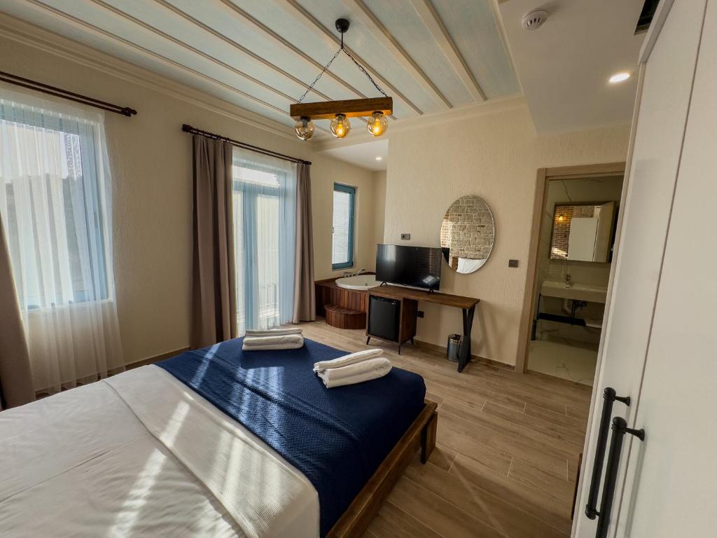 Postel nebo postele na pokoji v ubytování Cunda Nisa Otel