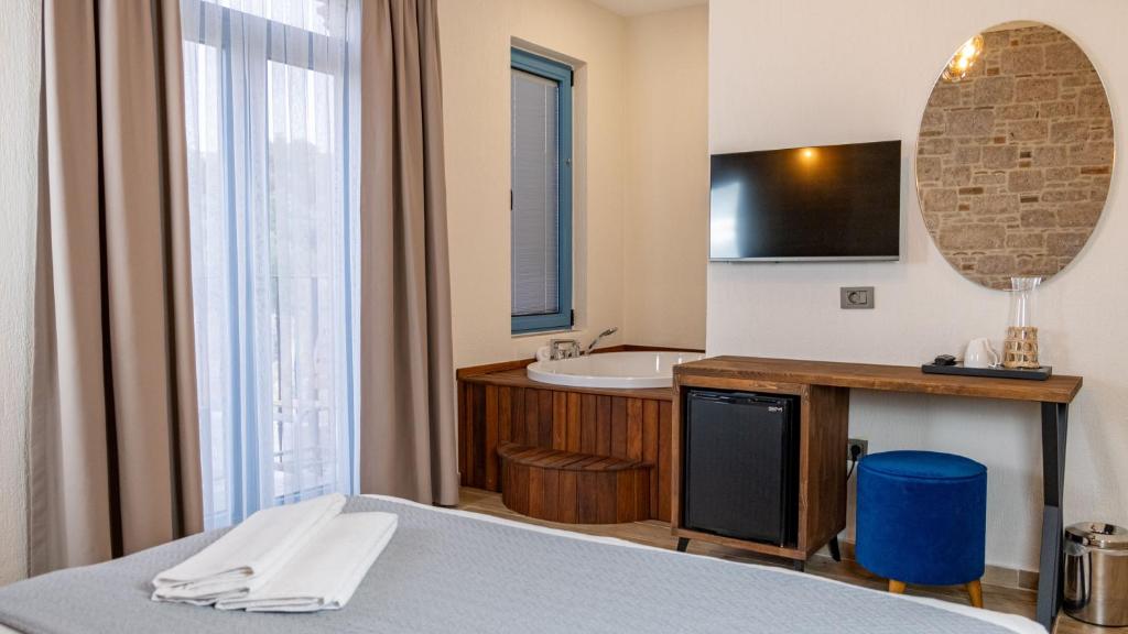 Postel nebo postele na pokoji v ubytování Cunda Nisa Otel