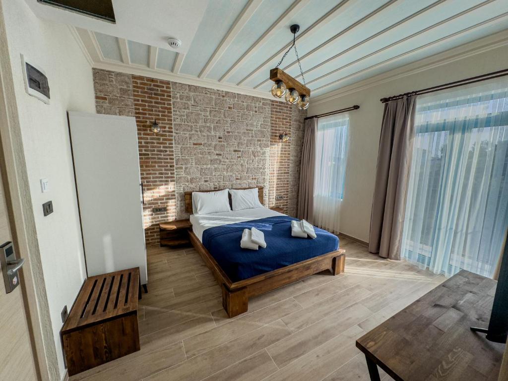Postel nebo postele na pokoji v ubytování Cunda Nisa Otel