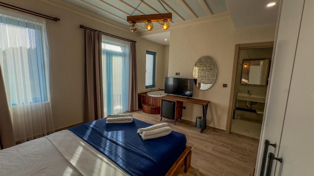 Postel nebo postele na pokoji v ubytování Cunda Nisa Otel