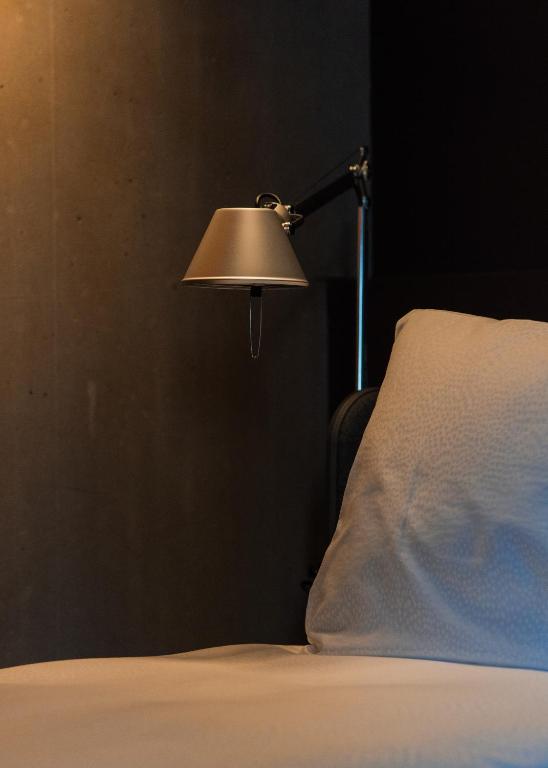 Postel nebo postele na pokoji v ubytování Hôtel Borsari, A Member of Design Hotels