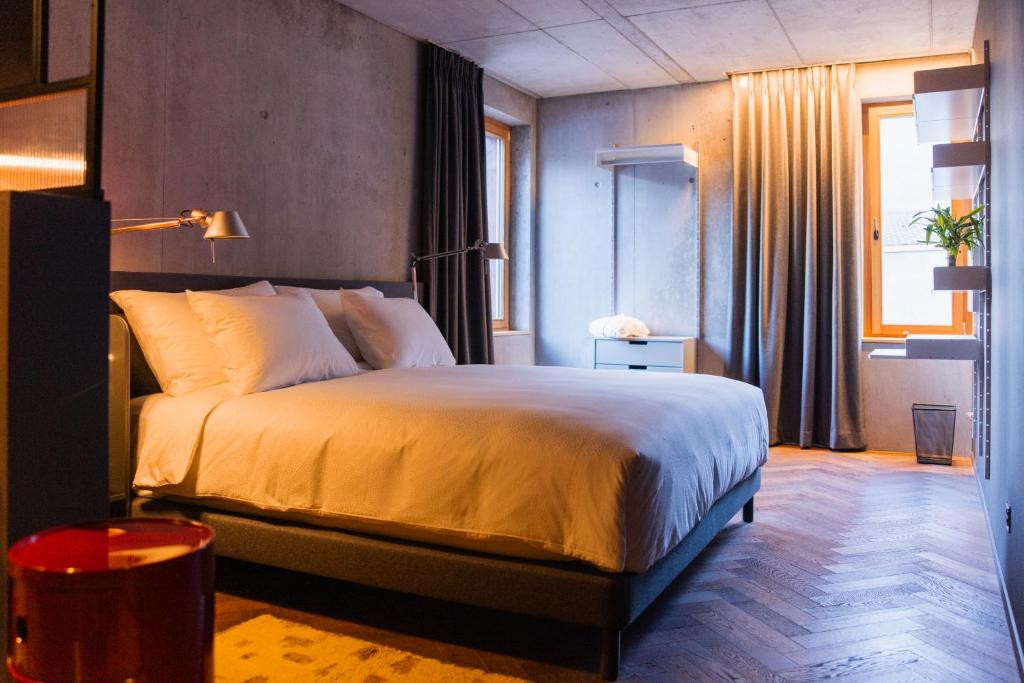 Postel nebo postele na pokoji v ubytování Hôtel Borsari, A Member of Design Hotels