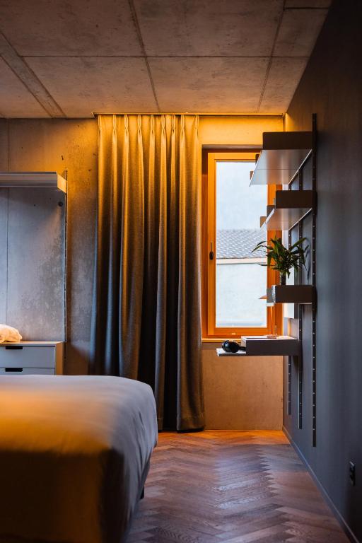 Postel nebo postele na pokoji v ubytování Hôtel Borsari, A Member of Design Hotels