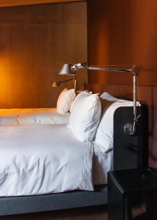 Postel nebo postele na pokoji v ubytování Hôtel Borsari, A Member of Design Hotels