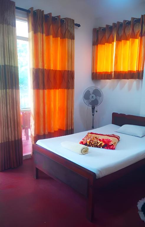 Postel nebo postele na pokoji v ubytování Senehas Homestay