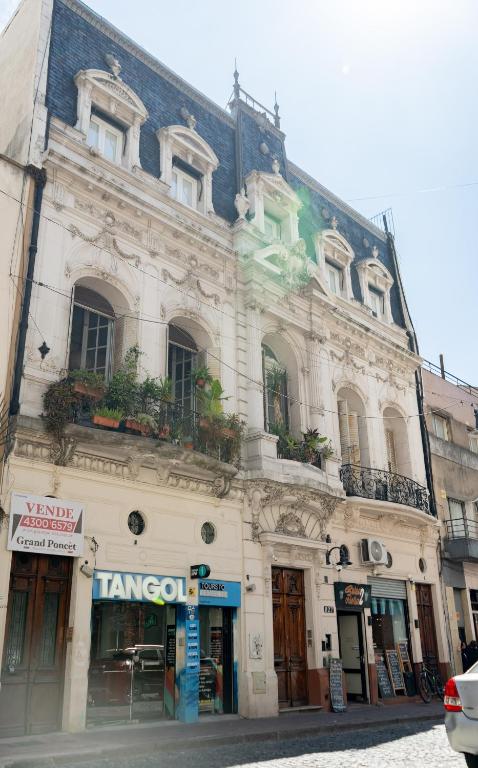 a large white building on a city street at Bellinzona Boutique in Buenos Aires