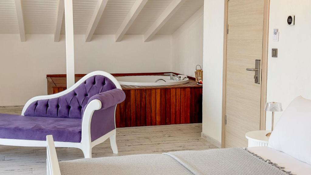 Postel nebo postele na pokoji v ubytování Cunda Nisa Otel