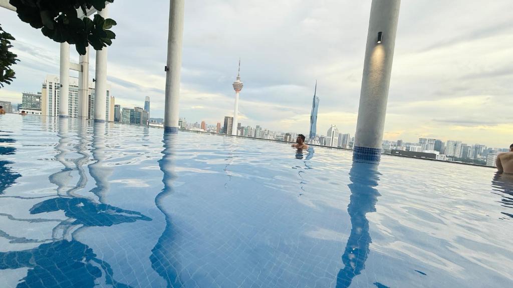 a swimming pool on the roof of a building at Colony Service Suites Kuala Lumpur in Kuala Lumpur