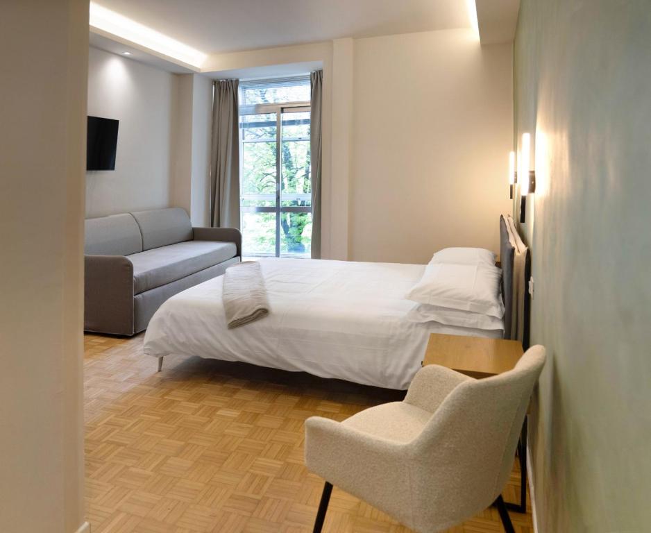 Postel nebo postele na pokoji v ubytování Giardini Rooms