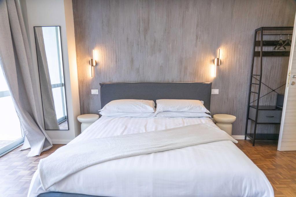 Postel nebo postele na pokoji v ubytování Giardini Rooms
