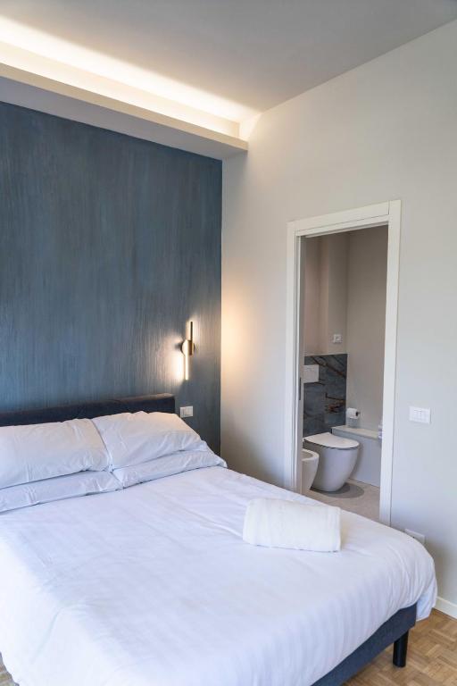 Postel nebo postele na pokoji v ubytování Giardini Rooms