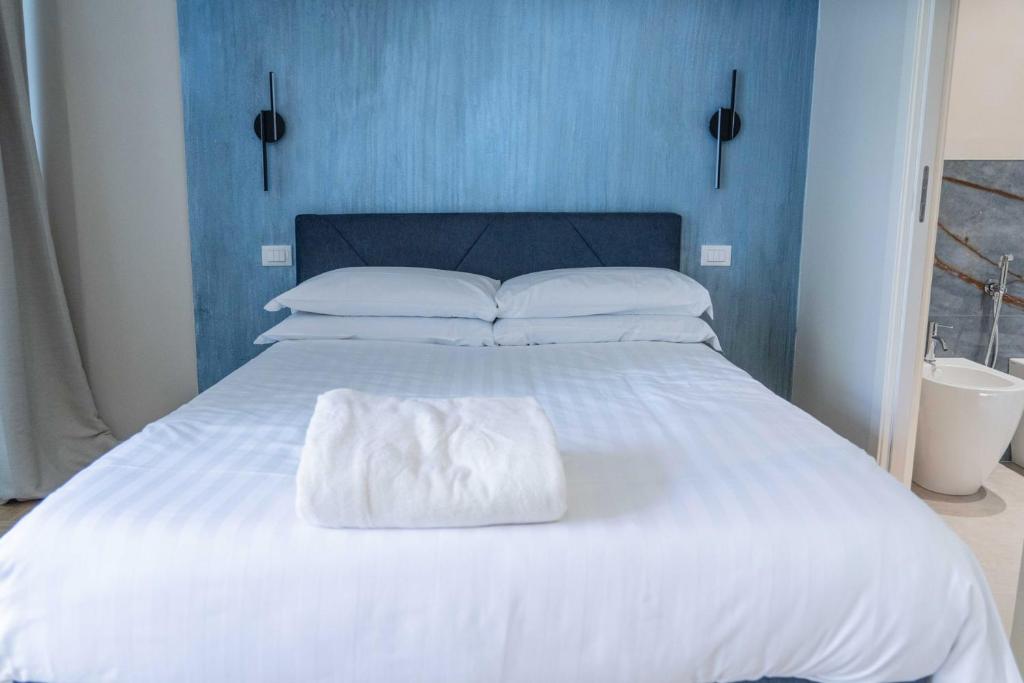 Postel nebo postele na pokoji v ubytování Giardini Rooms